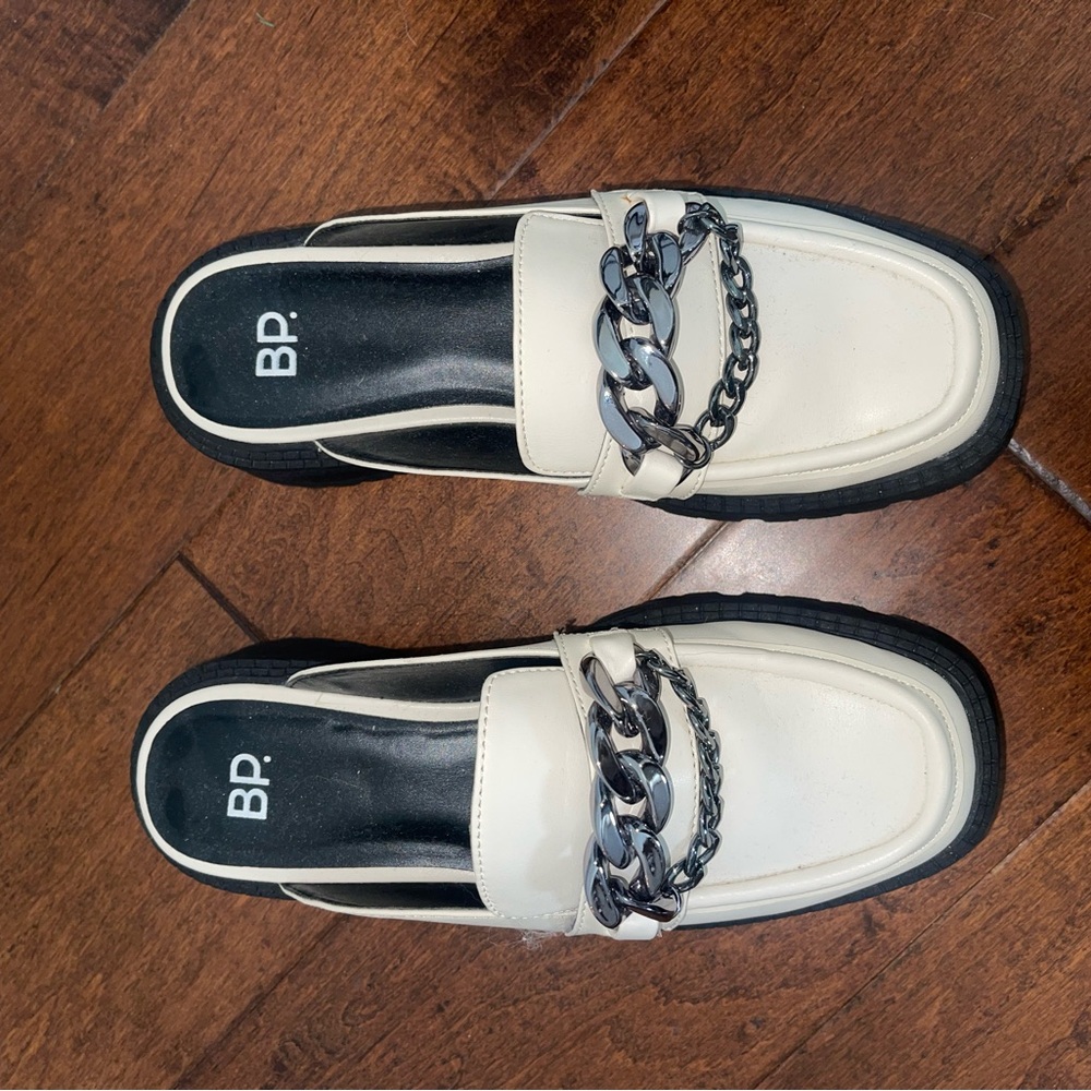 BP- Black and white loafers with chain details